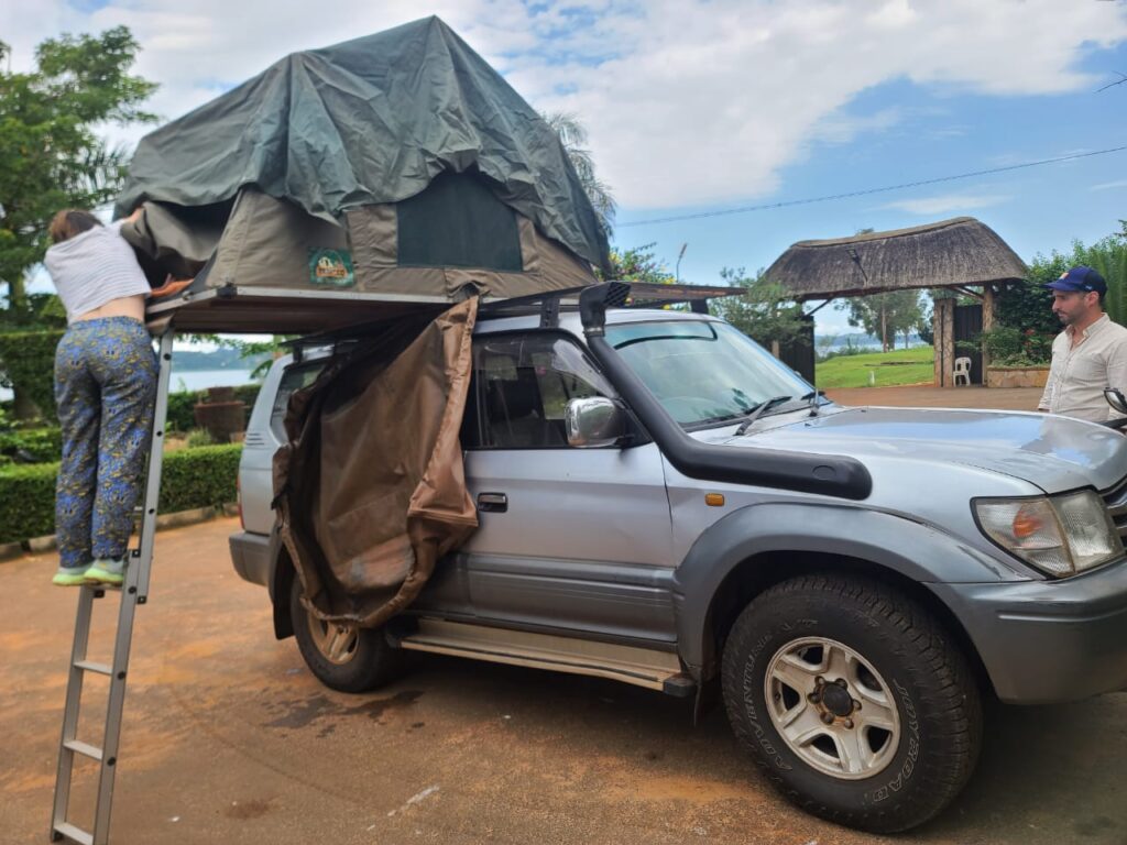 setting up a land cruiser prado (TX/TZ) Rental Uganda with a rooftop Tent
